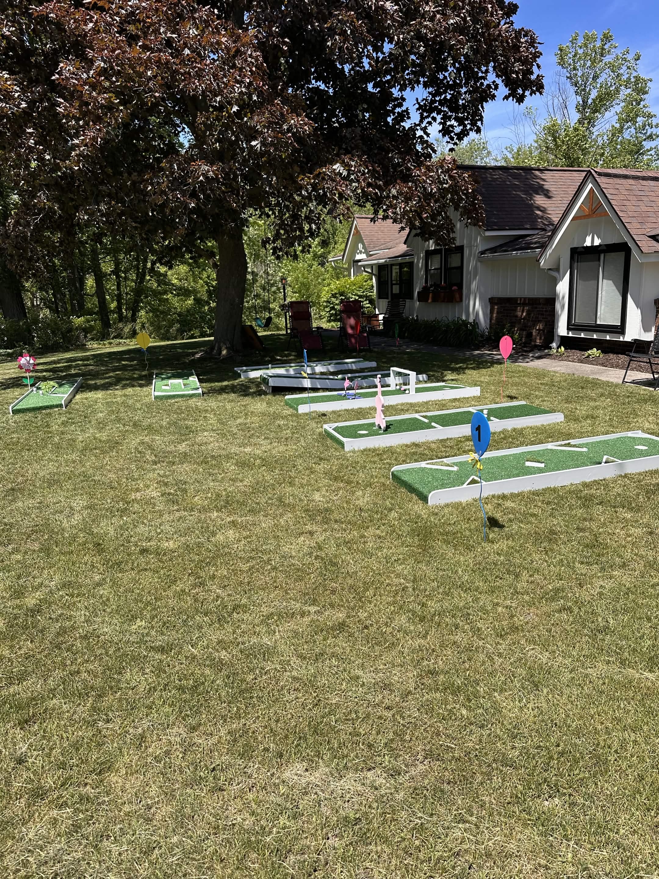 Kid playing mini golf at a Puttin Party event
